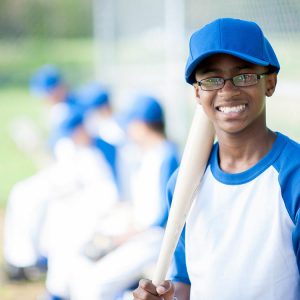 Young baseball player smiling