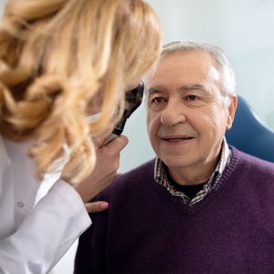 Older man receiving eye exam