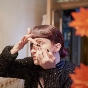 Woman putting in contact lenses