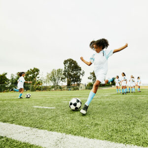 young girls playing soccer