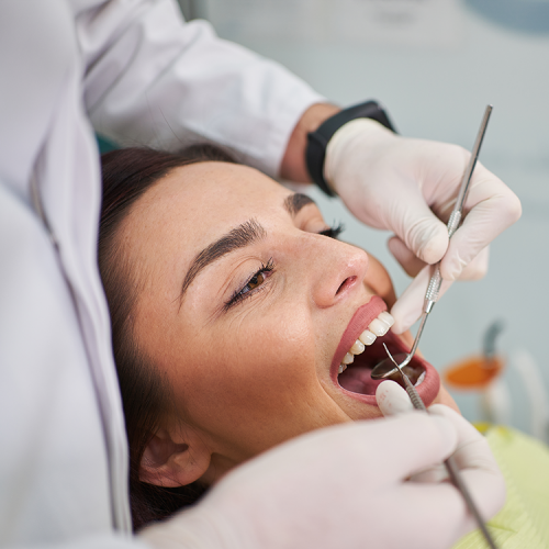 woman receiving dental exam
